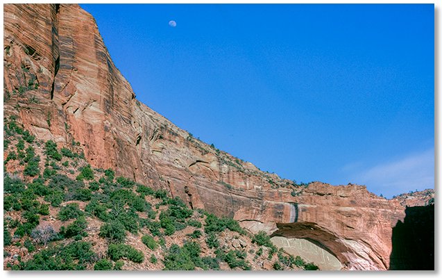 Almost-full moon and Great Arch from the switchbacks below the tunnel
